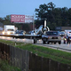Illustration for article titled Video of a WWII-era Airplane Landing on a Busy Highway